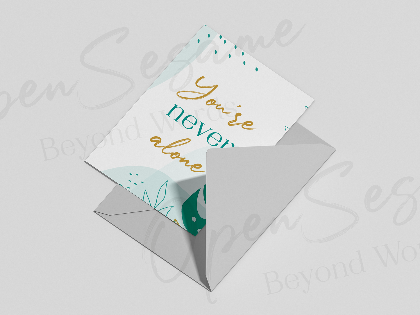Front of card in support of those with cancer that reads ‘You're Never Alone’.