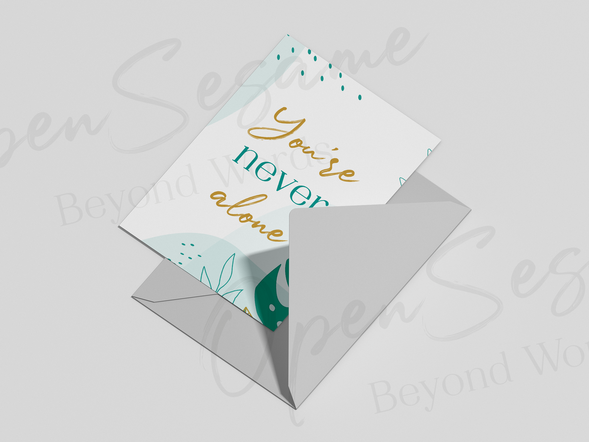 Front of card in support of those with cancer that reads ‘You're Never Alone’.