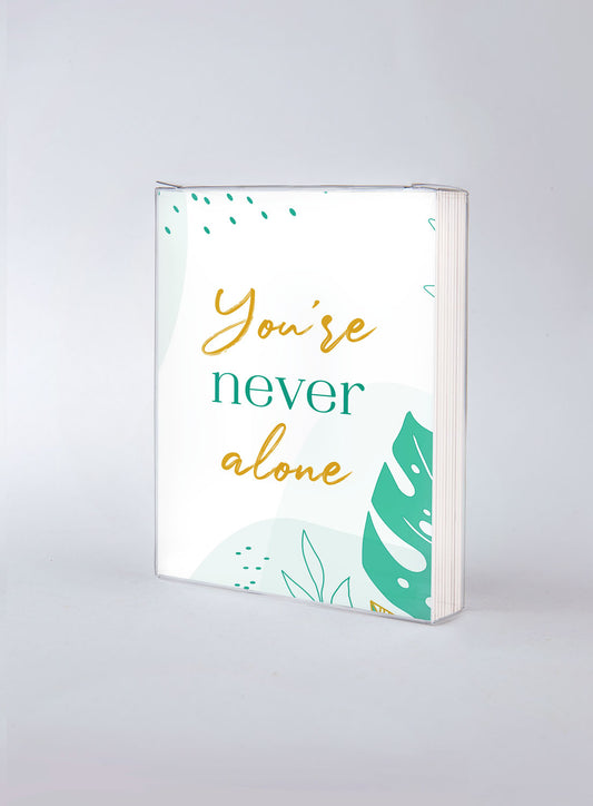 Front of card in support of those with cancer that reads ‘You're Never Alone’.  Open Sesame Cards